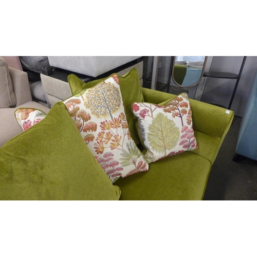 1345 - An apple metallic upholstered four seater sofa