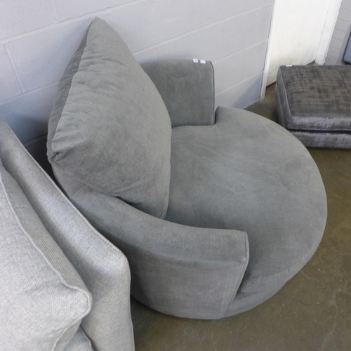 1304 - A fossil grey upholstered swivel love seat