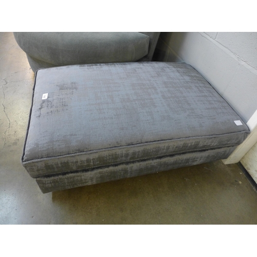 1305 - A Dolce magnesium upholstered rectangular cushioned top footstool