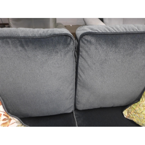 1308 - A carbon metallic upholstered 2.5 sofa with scatter cushions and ottoman foot stool