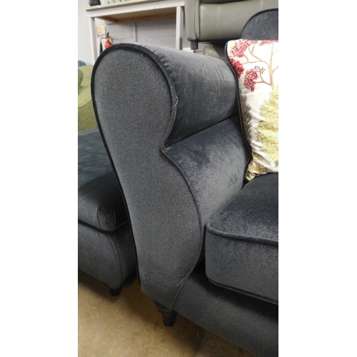 1308 - A carbon metallic upholstered 2.5 sofa with scatter cushions and ottoman foot stool