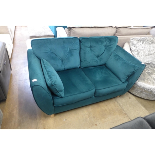 1315 - A Hoxton teal velvet two seater sofa - odd cushion