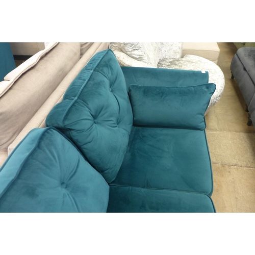 1315 - A Hoxton teal velvet two seater sofa - odd cushion