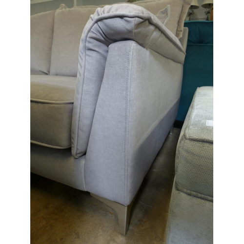 1317 - A concrete grey upholstered three seater sofa