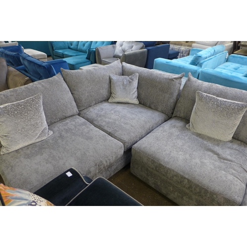 1337 - A large grey textured velvet corner sofa with patterned scatter cushions