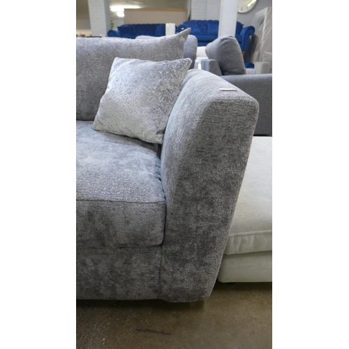 1337 - A large grey textured velvet corner sofa with patterned scatter cushions