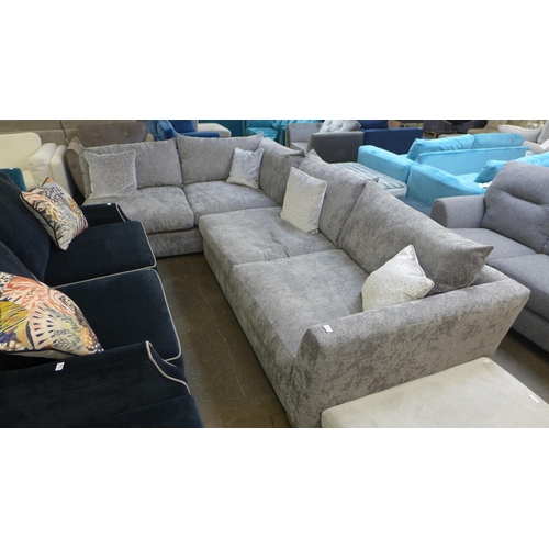 1337 - A large grey textured velvet corner sofa with patterned scatter cushions