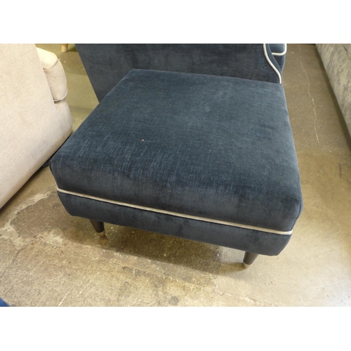 1338 - A Liberty black and light grey piping upholstered three seater sofa with matching footstool