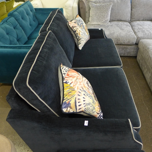 1338 - A Liberty black and light grey piping upholstered three seater sofa with matching footstool