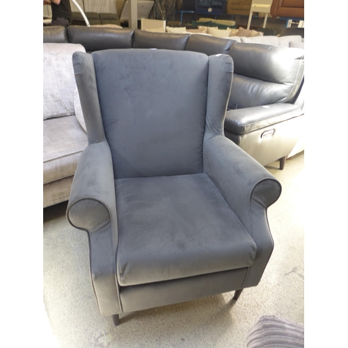 1360 - An ash grey velvet wingback armchair