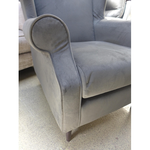 1360 - An ash grey velvet wingback armchair