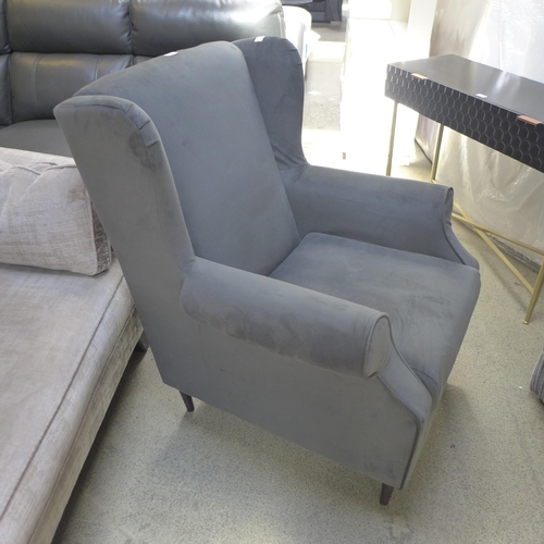 1360 - An ash grey velvet wingback armchair