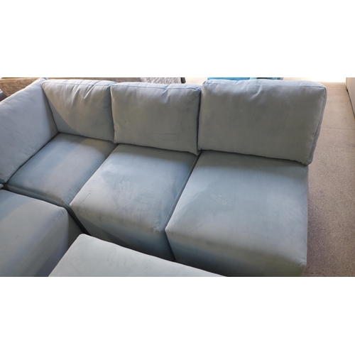 1382 - A sky blue velvet sectional corner sofa and footstool