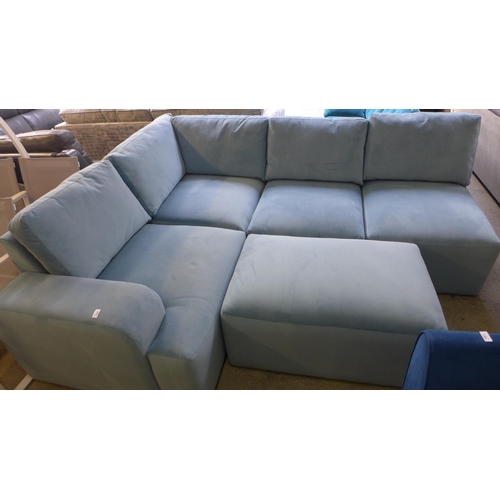 1382 - A sky blue velvet sectional corner sofa and footstool