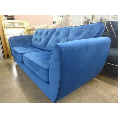 1348 - A Hoxton deep blue velvet three seater sofa