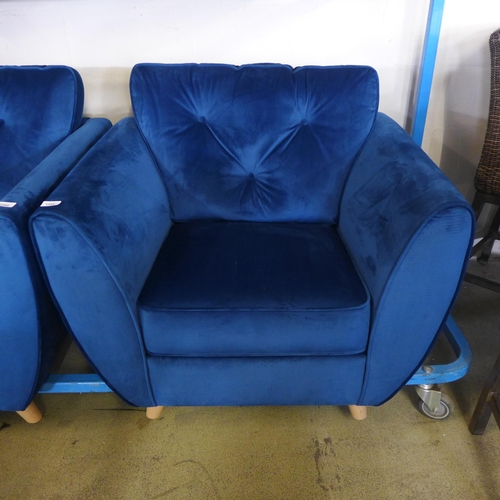 1555 - A Hoxton deep blue velvet button backed armchair