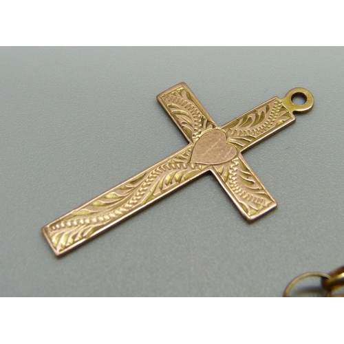 951 - A 9ct gold chain, Star of David pendant, cross pendant and one other 9ct gold pendant, 12.8g