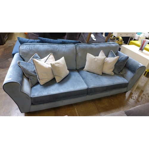 1312 - A diamond blue velvet upholstered four seater sofa