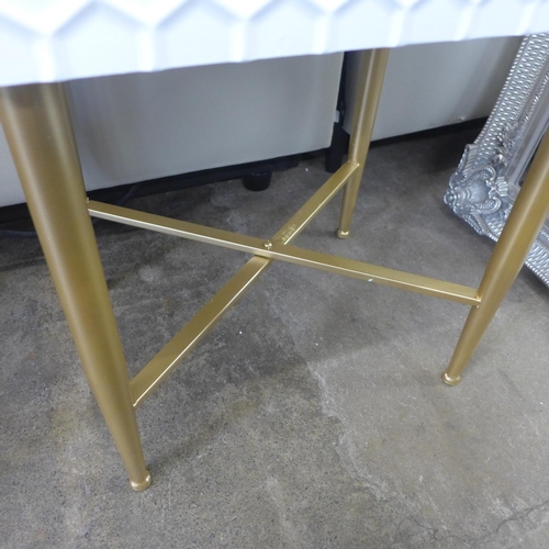 1314 - A white bedside table with gold legs