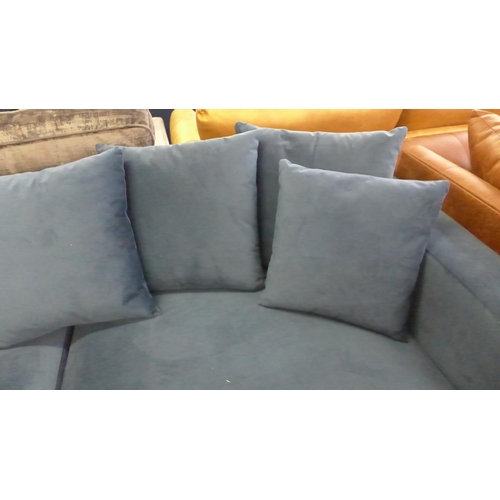1341 - A blue velvet upholstered scatter back 4.5 seater sofa