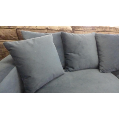 1341 - A blue velvet upholstered scatter back 4.5 seater sofa