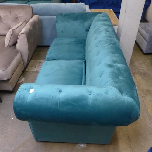1345 - A teal velvet Chesterfield style three seater sofa RRP £879