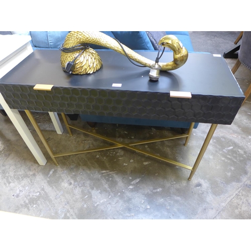 1402 - A black console table on gold legs