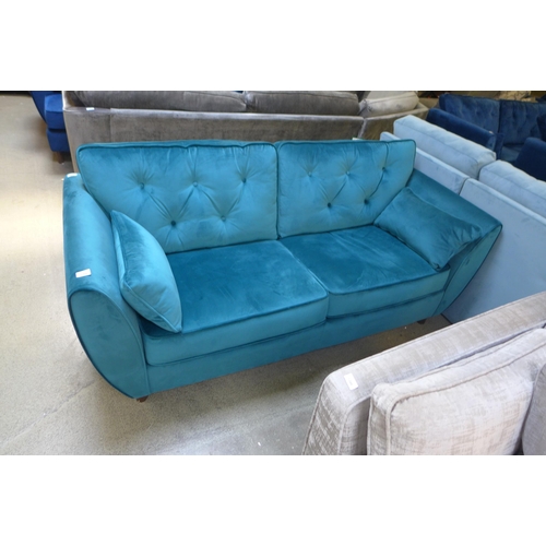 1438 - A Hoxton teal velvet three seater sofa