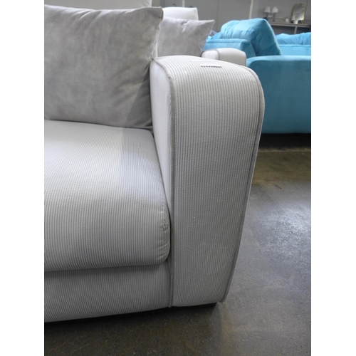 1446 - A frost white with grey piping corduroy upholstered two seater sofa