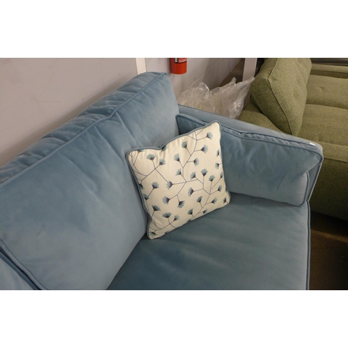 1467 - A diamond blue velvet three seater sofa with floral scatter cushions