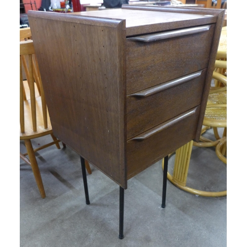 33 - A teak three drawer chest on steel stand