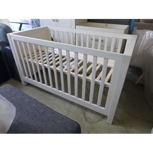 1595 - An ash effect cot bed  * This lot is subject to VAT