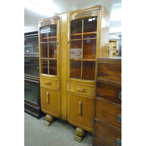 141 - A carved oak four door bookcase