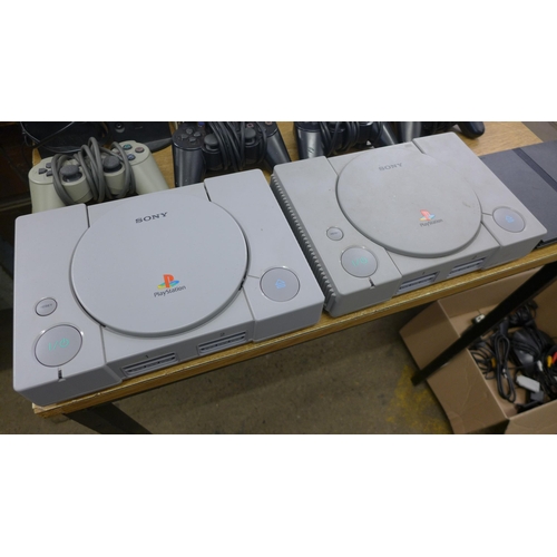 2088 - Two Playstation 1's, Playstation 2 slimline edition, 3 Playstation Duelshock 2 controllers, Playstat... 