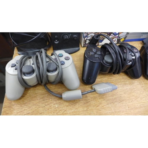 2088 - Two Playstation 1's, Playstation 2 slimline edition, 3 Playstation Duelshock 2 controllers, Playstat... 
