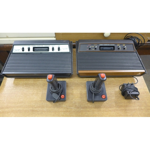 2104 - Atari video computer system and one other video computer console with 2 joy sticks and cables