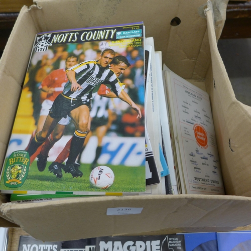 2136 - Box of football programmes & signed Dennis Law football picture