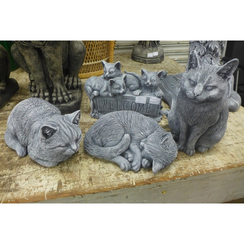 2230C - Four concrete cat ornaments