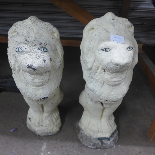 2230E - Pair of painted stone lions