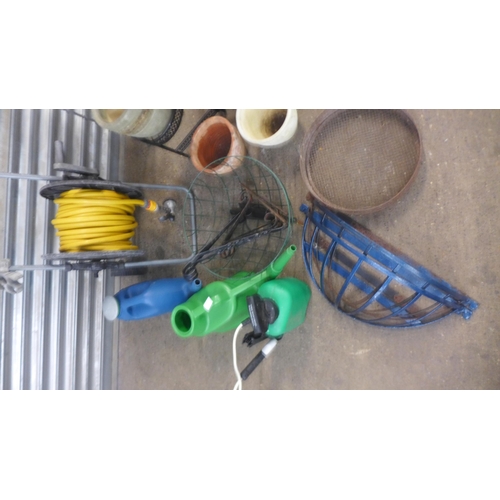 2238 - Job lot of gardening equipment; hose pipe, watering cans, plant pots, etc.