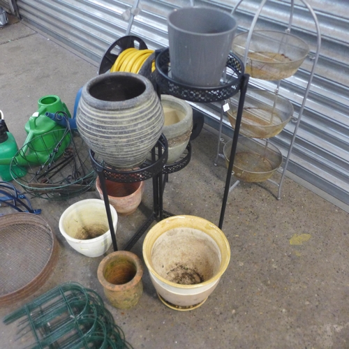 2238 - Job lot of gardening equipment; hose pipe, watering cans, plant pots, etc.