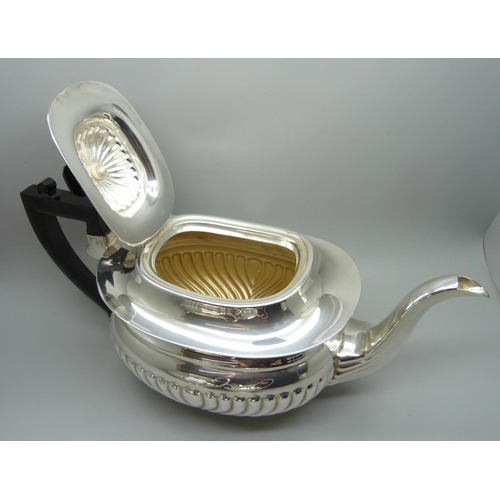 819 - A two-handled brass tray, copper bowl and brass plate or tray