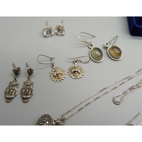 1002 - Six silver pendants and chains and seven pairs of silver earrings