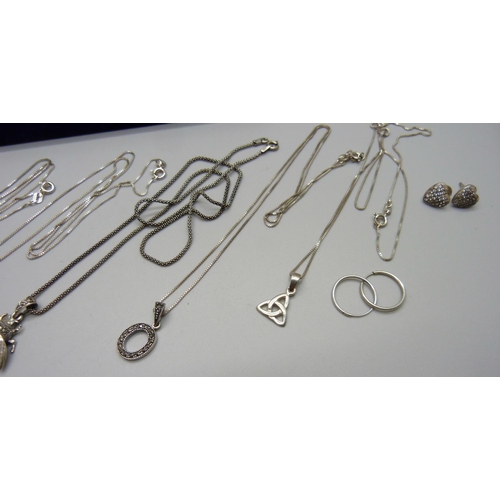 1002 - Six silver pendants and chains and seven pairs of silver earrings