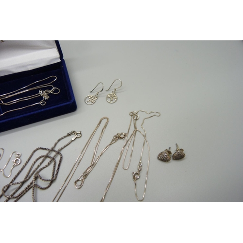 1002 - Six silver pendants and chains and seven pairs of silver earrings