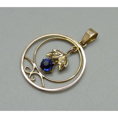 1015 - An Edwardian 9ct gold, blue stone and pearl pendant