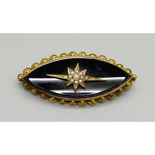 1026 - A Victorian yellow metal mourning brooch set with seed pearls