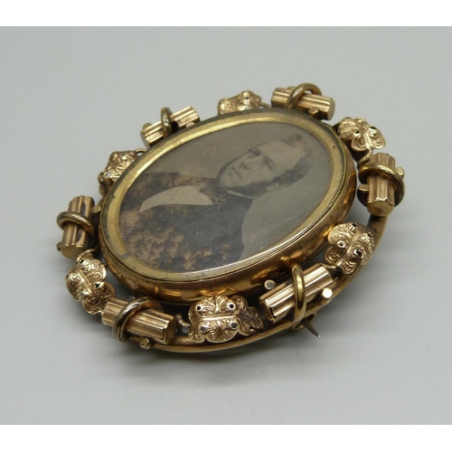 1032 - A large Victorian gold plated photograph pendant/brooch with double sided swivel section