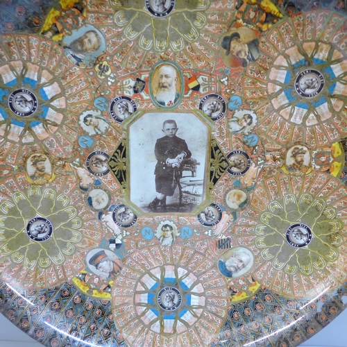 601 - A decoupage shallow bowl in glass with photograph of young boy, (possibly a memorial plate), 31cm