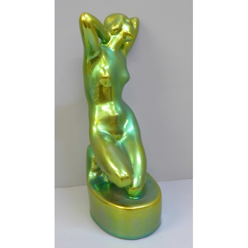 607 - A Zsolnay Pecs Hungary model of a nude female figure, eosin green/gold lustre glaze, 25cm